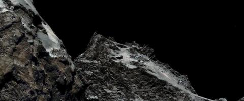Why did scientists land a probe on the surface of a comet?